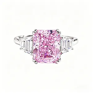 925 silver ring featuring a radiant cut pink gemstone with baguette side diamonds