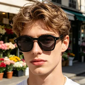Close-up of vintage square black sunglasses on male model featuring metal hinge detail