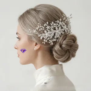 Detailed side view of handmade bridal hair comb with pearls, crystals and silver leaves