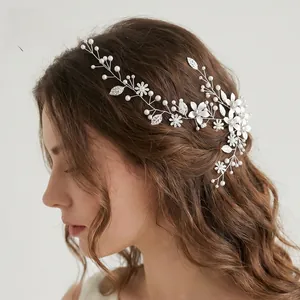 Detail of bridal pearl and rhinestone vine headband with adjustable silver leaf branches
