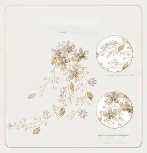Detailed view of handmade pearl flower headband with gold leaves and rhinestones