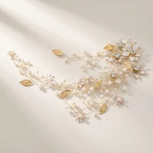 Golden bridal headband with delicate pearls, leaves and floral rhinestones