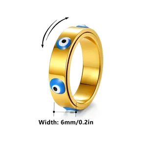Bague rotative de 6mm en acier doré avec motifs œil maléfique bleu sur fond blanc