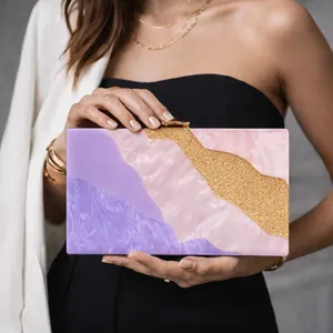 Elegant acrylic clutch bag with purple marble patterns and gold glitter accents