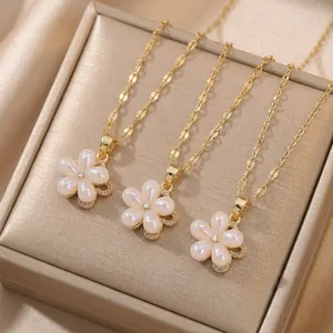Elegant gold titanium steel necklace featuring iridescent pearl flower pendants and zircon