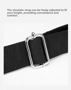 Detail of adjustable nylon shoulder strap with silver metal buckle on black crossbody bag