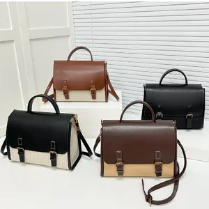 Retro messenger bags in four colorways featuring top handles and adjustable shoulder straps