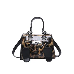 Mini leopard print handbag with cartoon feet charms and shiny patent finish