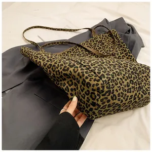 Detailed close-up of the vintage leopard print tote bag with durable canvas material