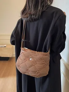 Brown padded space cotton crossbody bag with quilted diamond pattern and strap