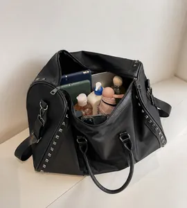 Macro view of high capacity travel bag showing organized storage for tablets and umbrellas