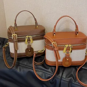 Borsa a tracolla retrò bicolore con manico superiore e cinturino regolabile