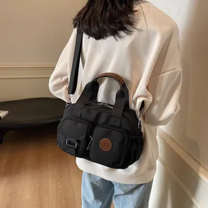 Multi-pocket black canvas crossbody bag with large capacity for women's winter commute