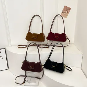 Minimalist crescent shoulder bags in four colors with suede finish and gold hardware