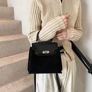 Retro black velvet Kelly handbag with suede panels and silver metal lock closure