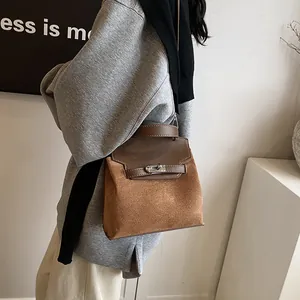 Brown frosted velvet Kelly bag with silver twist lock and smooth leather splicing detail