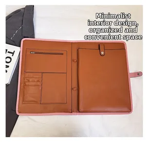 Close-up of minimalist canvas office folder with multi-slot leather interior and pen holder