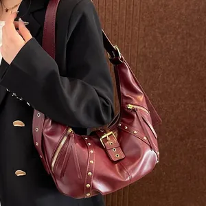 Retro wine red crescent hobo bag with gold hardware and rivets in vintage biker style