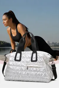 Quilted silver gym bag detail featuring large capacity storage and adjustable shoulder straps