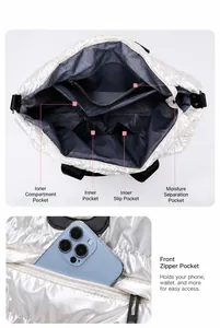 Detailed interior of a metallic silver tote bag with multiple storage compartments