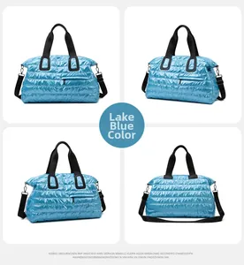 Lake blue quilted travel bag with waterproof nylon fabric and detachable shoulder straps