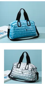 Quilted waterproof gym bags in shiny blue and silver finishes with shoulder straps