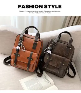 Detail of vintage faux leather backpacks with metal rivets and cute bear charms