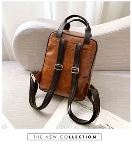 Detailed macro view of vintage caramel brown leather backpack with adjustable straps