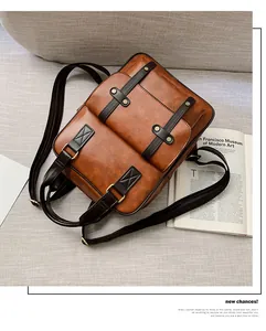 Detail view of caramel brown vintage backpack featuring front pockets and premium PU leather texture