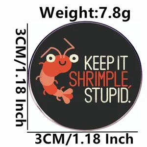 Funny red shrimp cartoon badge with Keep It Shrimple Stupid text on black background