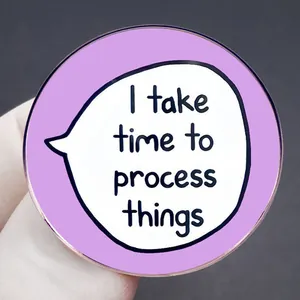 Round purple mental health badge with I take time to process things lettering in hand