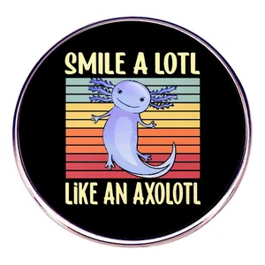 Close-up of a round axolotl anatomy pin badge with retro sunset design and fun text