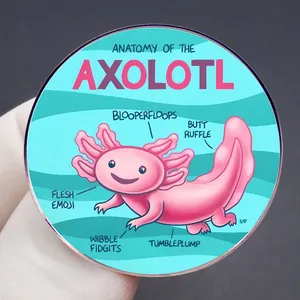 Detail showing an Anatomy of the Axolotl enamel pin held in hand for size reference
