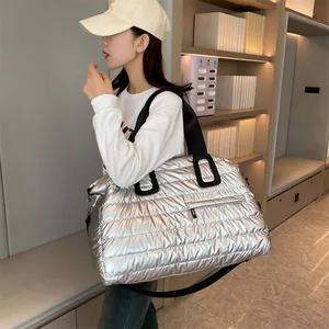 Quilted silver tote bag with padded down design for gym travel or yoga commuting