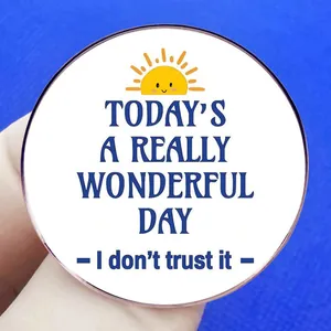 Round humor brooch featuring a sun icon and Today's a really wonderful day text