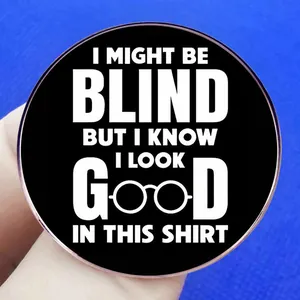 Round humor brooch pin with 'I LOOK GOOD IN THIS SHIRT' text on black background