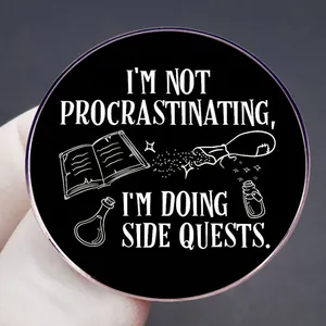 Black round enamel pin with Side Quests slogan and magic icons on metal badge
