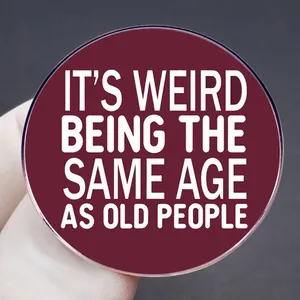 Funny 'It's Weird Being The Same Age As Old People' round red metal pin badge