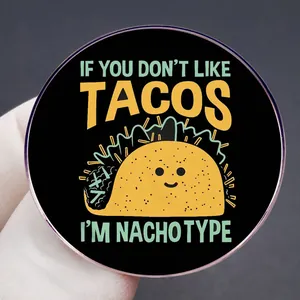 Round taco pin with humor quote If You Don't Like Tacos I'm Nacho Type on black base