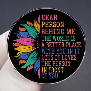 Motivational round sunflower brooch with 'Dear Person Behind Me' rainbow text