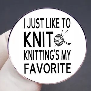 Knitting hobby enamel pin featuring slogan I Just Like to Knit and yarn ball illustration