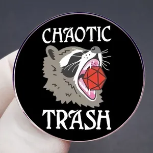 Chaotic Trash raccoon enamel pin featuring a D20 dice for RPG fans and gamers