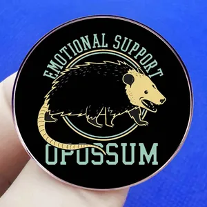 Funny Opossum metal pin badge with Emotional Support Opossum text on blue background