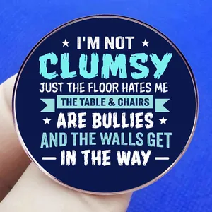 Blue enamel pin badge with humorous English text and star icons on a bright background