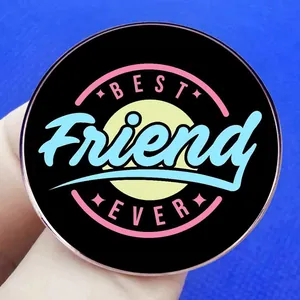 Retro Best Friend Ever circular metal brooch pin with colorful art lettering on black base