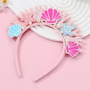 Close-up of pink mermaid headband with sequins, shells, starfish, and white pearls