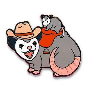 Cowboy opossum enamel pin featuring a small possum on a red saddle with metal edges