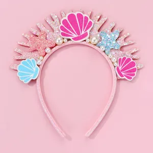 Detail of mermaid headband with glitter shells, starfish and pearls for party wear