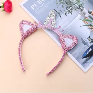Detailed view of pink glitter unicorn headband with silver crown and sparkly cat ears