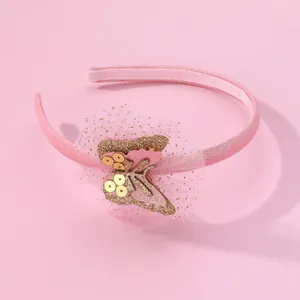 Detailansicht eines rosa Schmetterlings-Haarreifens mit goldenen Pailletten für Mädchen